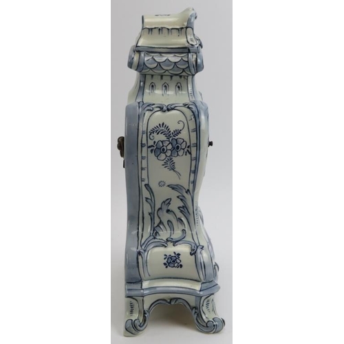 226 - A German Delft ceramic mantle clock. French brass movement. Identical in style to German clocks manu... 