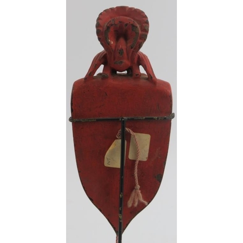 229 - A Southeast Asian red lacquered and carved wood plumb line. Modelled with surmounted bird and cord s... 