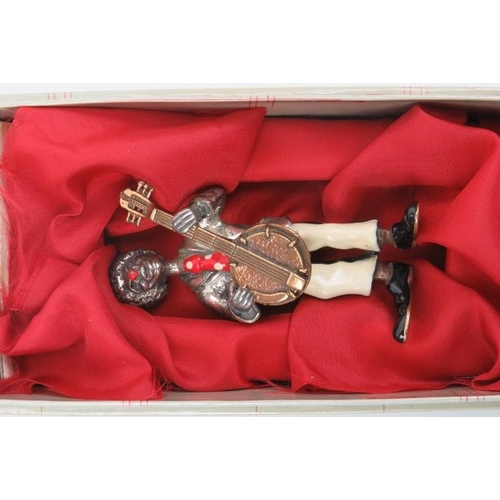 24 - An Italian Sorini enamelled and parcel gilt silver figure of a clown with banjo, 20th century. Struc... 