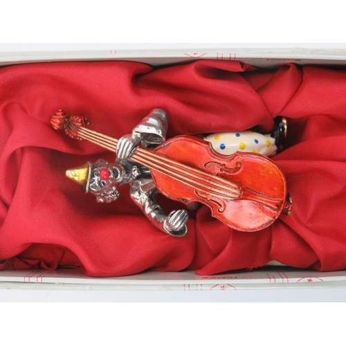 25 - An Italian Sorini enamelled and parcel gilt sterling silver figure of a clown with double bass, 20th... 