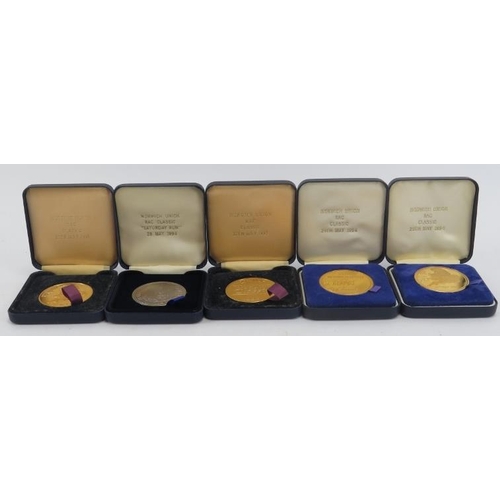 255 - Automobilia: Five Norwich Union RAC Classic Car medallion coins, circa 1994. (5 items).
Condition re... 