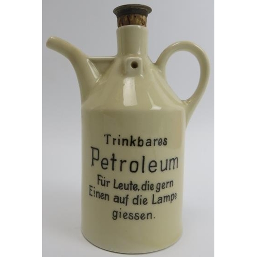 264 - A group of German white glazed and creamware ceramic kitchenalia and a Ruppel Geschützt ‘Petroleum’ ... 