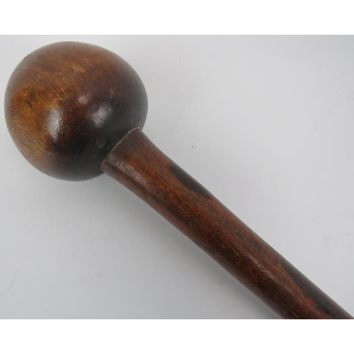 276 - Tribal Art: A South African carved wood knobkerrie. Globular shaped club head mounted on a tapered w... 