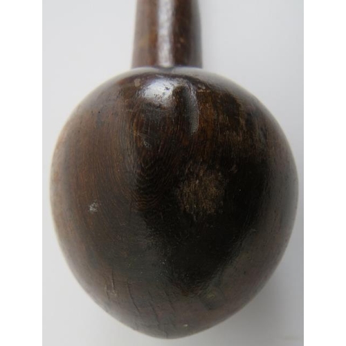 276 - Tribal Art: A South African carved wood knobkerrie. Globular shaped club head mounted on a tapered w... 