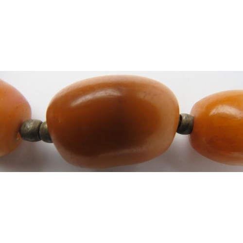 277 - Tribal Art: An African amber beaded necklace. 60 cm approximate length. 
Condition report: Some age ... 