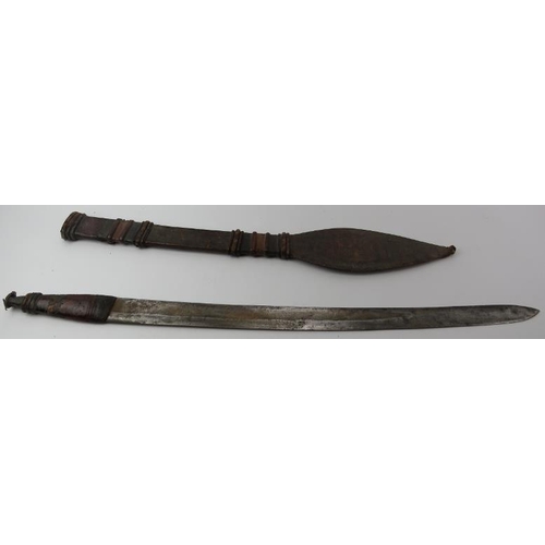 282 - Tribal Art: An African leather bound sword, possibly Sengal. Incorporated with a French steel blade.... 