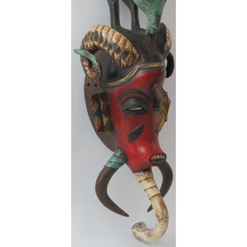 286 - Tribal Art: An African carved and painted wood mask, Baule (Baoulé) people, Cameroon. Depicted with ... 