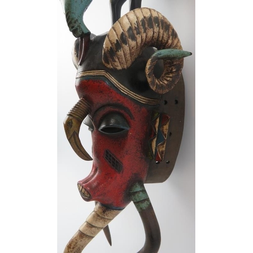 286 - Tribal Art: An African carved and painted wood mask, Baule (Baoulé) people, Cameroon. Depicted with ... 