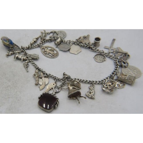 302 - Two possibly silver link bracelets joined together with a large amount of silver & white metal charm... 