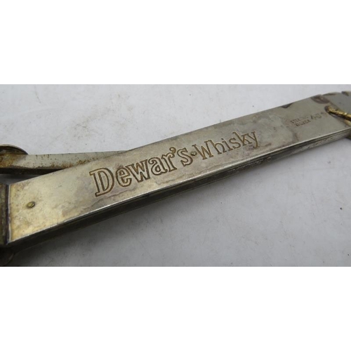 318 - A good sized sterling silver cigar cutter, 'Dewan's Whisky'. Approx 14cm long, approx weight 2.4 tro... 