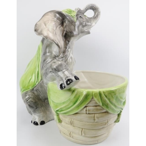 32 - A large ceramic jardiniere modelled with an elephant, 20th century. 52 cm height. 
Condition report:... 