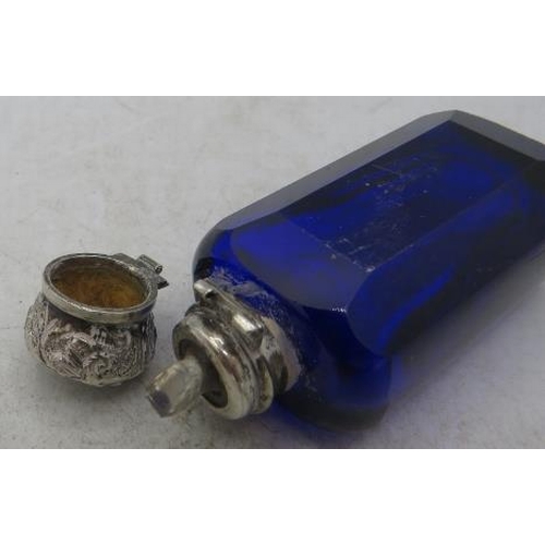 322 - A Bristol blue scent bottle with hinged white metal embossed top and inner stopper.
Condition report... 