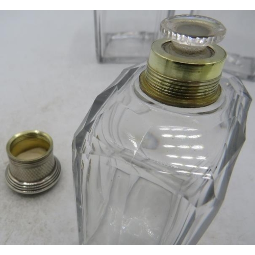 328 - A set of three panel cut glass scent bottles with white metal screw tops and inner stoppers.
Conditi... 