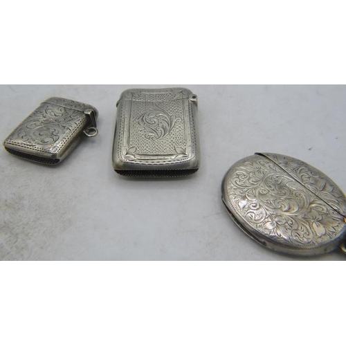 331 - A collection of three silver engraved & monogrammed vesta cases, two Birmingham 1901 and one Birming... 