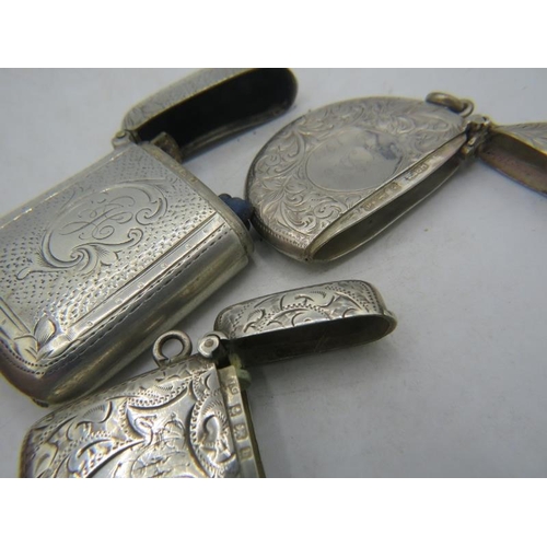 331 - A collection of three silver engraved & monogrammed vesta cases, two Birmingham 1901 and one Birming... 