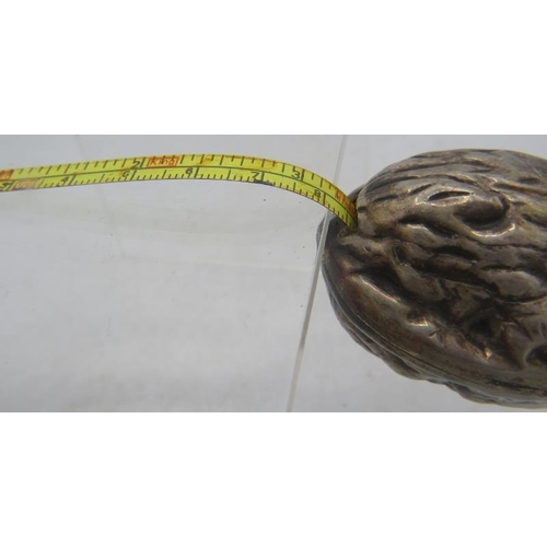 334 - An unusual silver novelty tape measure in the form of a walnut, marked 925. Approx weight 49 grams.
... 