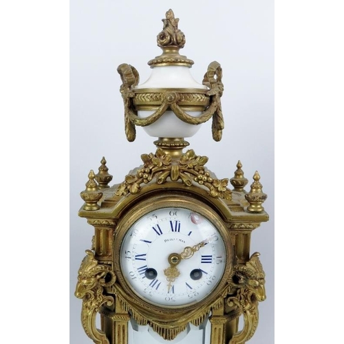 35 - A French style gilt brass and alabaster mantel clock with matching two branch candelabra garnitures,... 