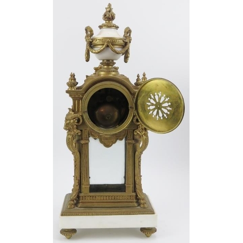 35 - A French style gilt brass and alabaster mantel clock with matching two branch candelabra garnitures,... 