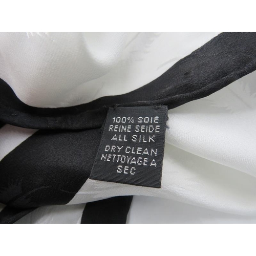 361 - A large Christian Dior Reine Seide square black & white silk scarf. Approx 52