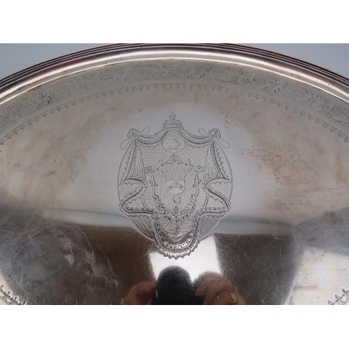 366 - A fine Georgian silver oval two handled tray, the centre engraved with the Monin's Family Crest and ... 