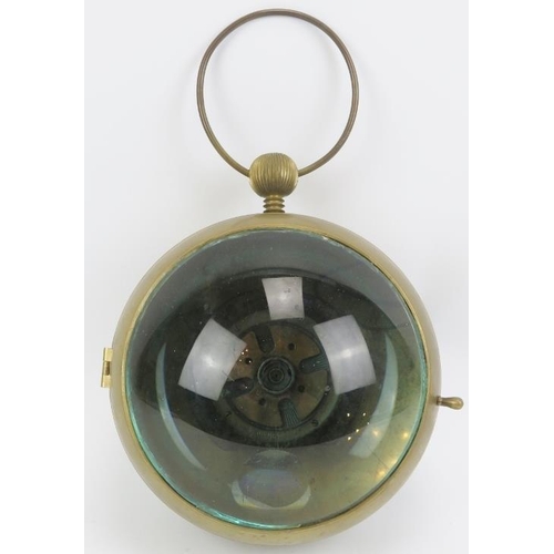 37 - A maritime brass and magnified green glass bullseye ball clock, 20th century. The spherical case wit... 