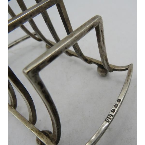 374 - A silver toast rack on ball feet, Birmingham 1918, George Unite. Approx weight 2.3 troy oz/72 grams.... 