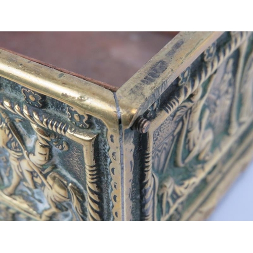 38 - A cast brass trinket jewellery box, 19th century. Decorated in shallow relief with figural panels to... 