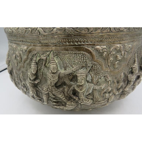 381 - A large Benares Asian white metal bowl, embossed with dancing figures. Approx 8