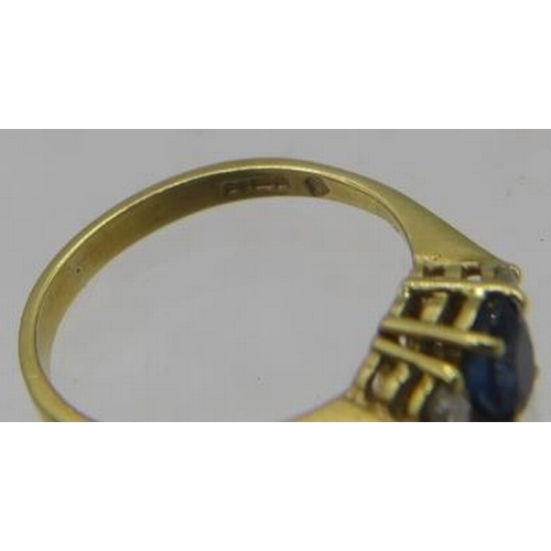 391 - An 18ct yellow gold ring set with centre sapphire & diamonds either side. Sapphire approx 5mm x 4mm,... 