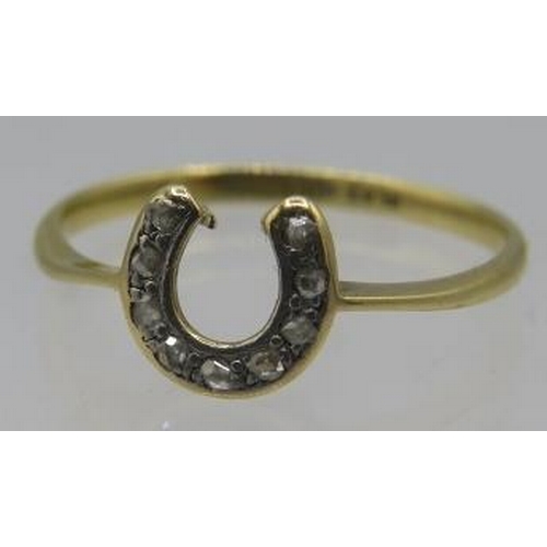 392 - An 18ct yellow gold horseshoe shaped ring set with nine small diamonds, size Q, boxed. Approx weight... 