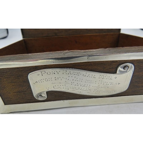 403 - A wooden cigarette box with silver edging and mounts engraved 'Pony Race Jan 1899 Won by J. Van der ... 