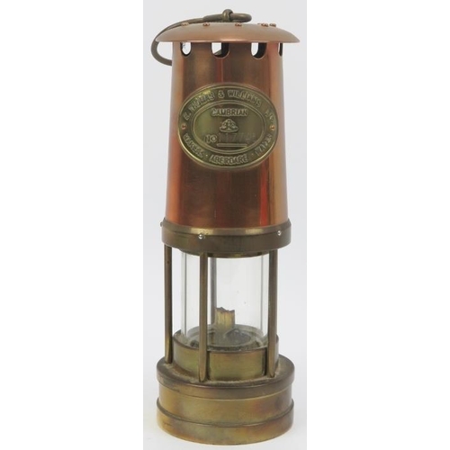 42 - A Thomas & Williams Ltd brass and copper Cambrian miners flame safety lamp, 20th century. With a Tho... 