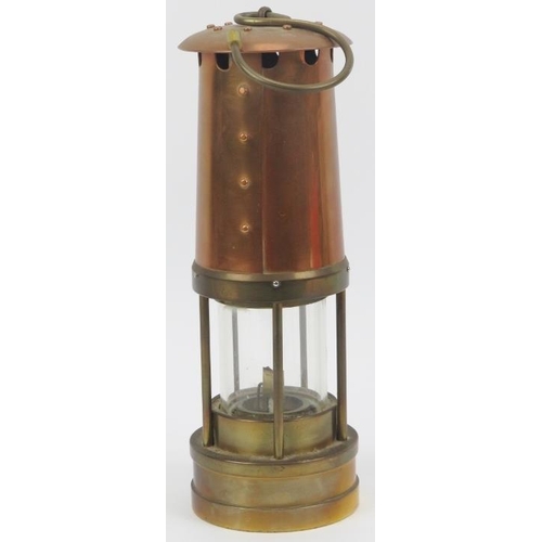 42 - A Thomas & Williams Ltd brass and copper Cambrian miners flame safety lamp, 20th century. With a Tho... 