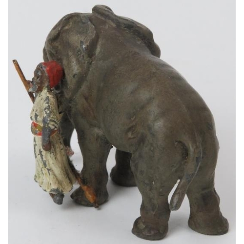 54 - A rare German cold painted lead figure of an Indian huntsman with elephant, early 20th century. Prob... 