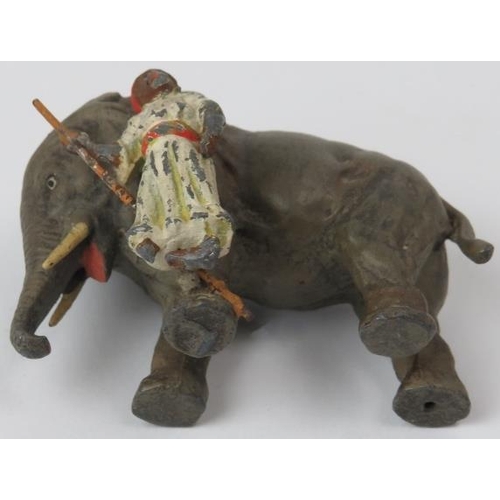 54 - A rare German cold painted lead figure of an Indian huntsman with elephant, early 20th century. Prob... 