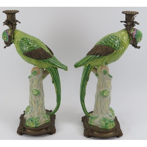 64 - A vintage pair of brass mounted porcelain green parrot candlesticks, late 20th century. WL 1895 cres... 