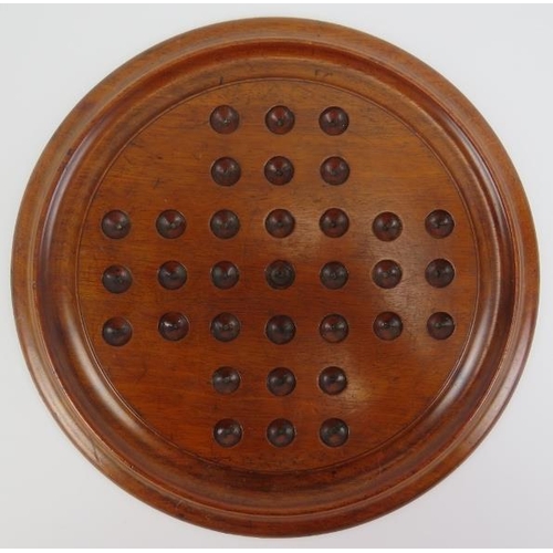 81 - A Victorian turned mahogany solitaire board with marbles. Board: 29.8 cm diameter. 
Condition report... 