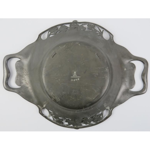 87 - An English Art Nouveau pewter twin handled bowl, early 20th century. With foliate clover decoration.... 