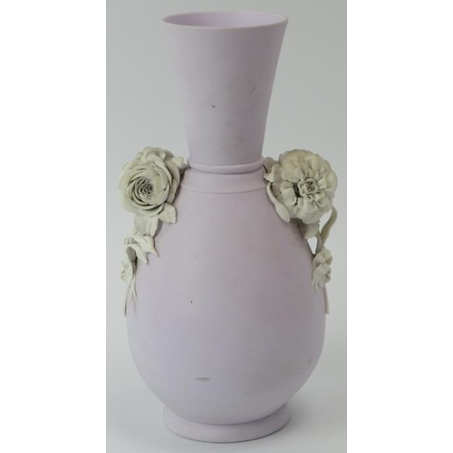 89 - A lilac ground jasperware vase with applied floral decoration in relief. Probably by Wedgwood and th... 