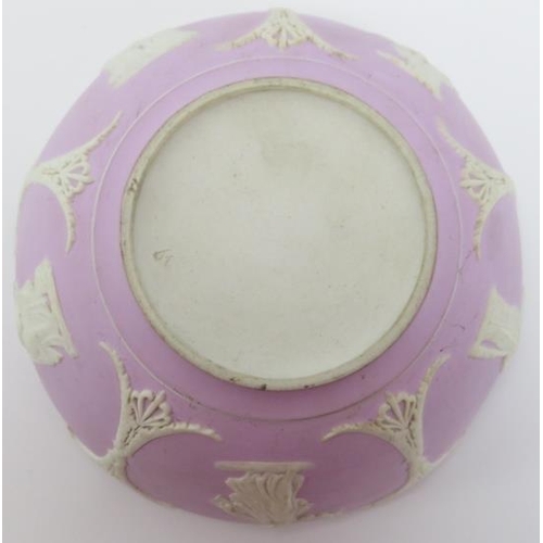 90 - A Victorian Wedgwood neoclassical lilac jasperware bowl. With applied white decoration in relief dep... 