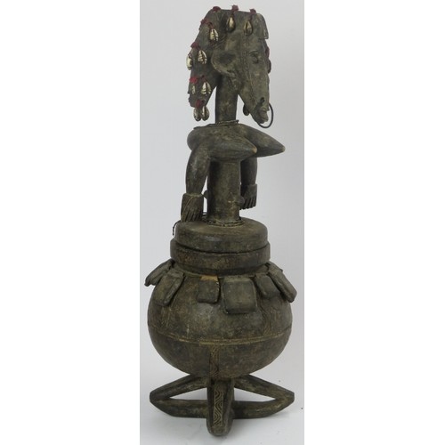 292 - Tribal Art: An African carved wood and leather ritual vessel and figural cover, Dogon people, Mali. ... 