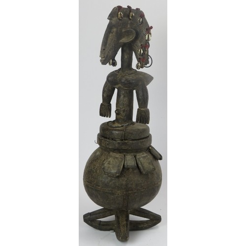 292 - Tribal Art: An African carved wood and leather ritual vessel and figural cover, Dogon people, Mali. ... 