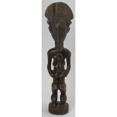 293 - Tribal Art: An African carved wood standing female figure with child, Lulua people, Congo (Zaire). 4... 