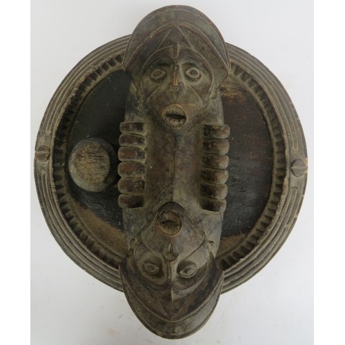 296 - Tribal Art: An African carved wood cola nut offering tray, Anambra State, Nigeria. 31 cm diameter. 
... 