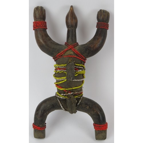 300 - Tribal Art: An African carved wood Namji doll, North Cameroon. Adorned with strands of glass beads. ... 