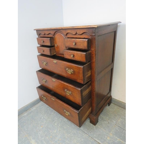 702 - A good quality solid oak chest by Titchmarsh & Goodwin in the 18th century taste, the shaped frieze ... 