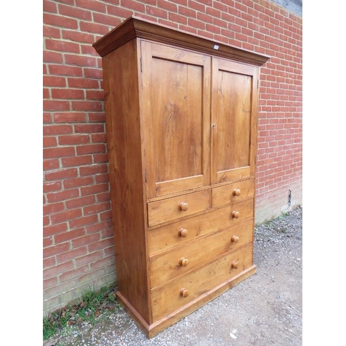 705 - A Victorian cherry wood linen press, the moulded cornice above twin panelled doors opening onto a cr... 