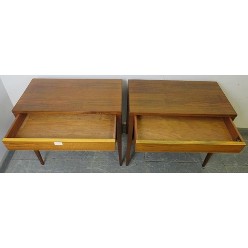 711 - A pair of mid-century tropical hardwood and teak side tables by Alfred Cox, each housing one long bl... 