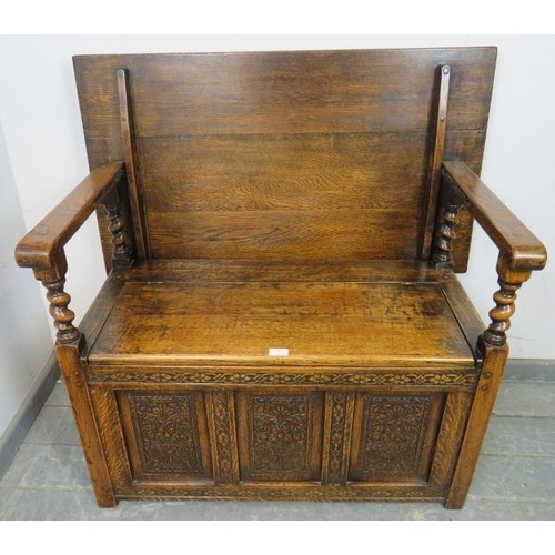 713 - A good quality medium oak monk’s bench in the 17th century taste, having a sliding backrest joined w... 