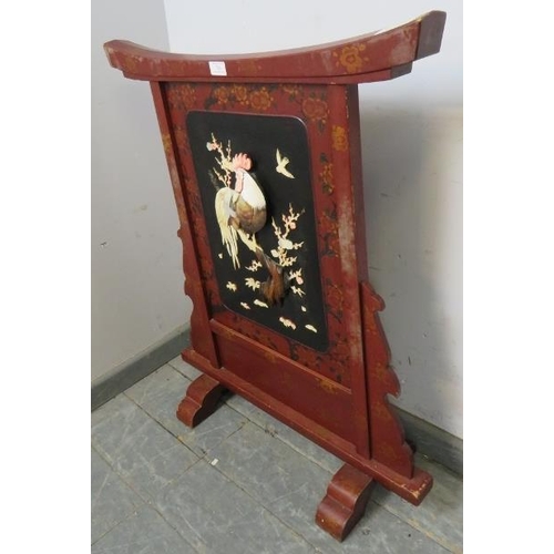 718 - An antique Japanese Shibayama red lacquer fire screen, having applied bone, mother of pearl, abalone... 